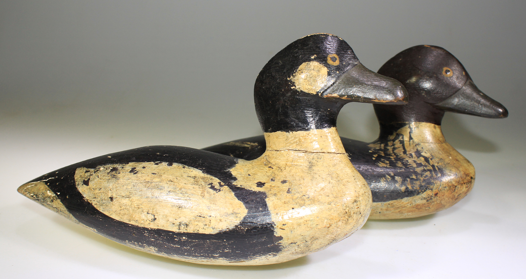 NICE PAIR OF GOLDENEYE DECOYS CARVED BY SAM HUTCHINS